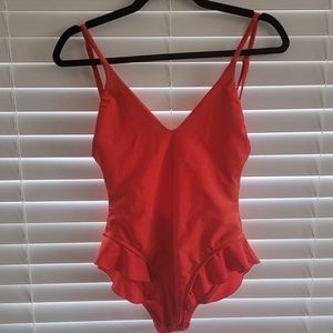 Red one piece bathingsuit or bodysuit from Lovewave XS